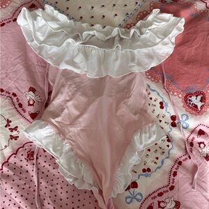 Pink body and ruffle white top
